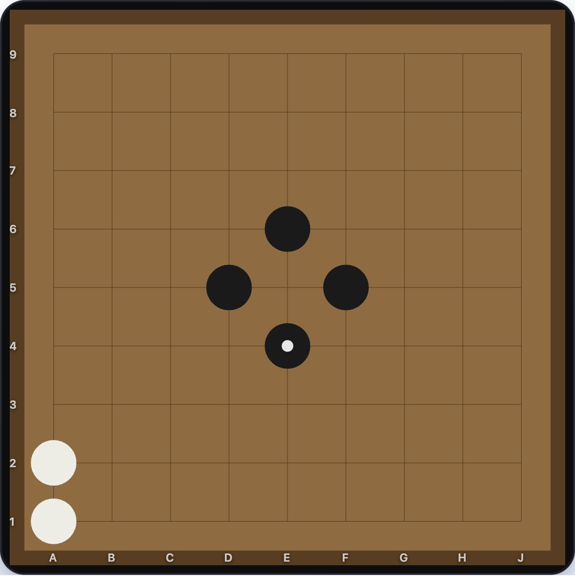 A single White stone on the 9x9 board surrounded by Black stones on three sides, with Black about to fill its final liberty